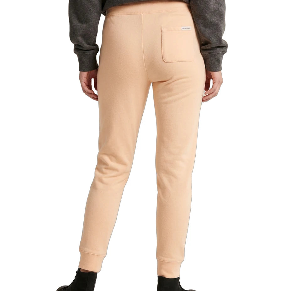 Person wearing beige jogger pants and a gray sweatshirt on a white background