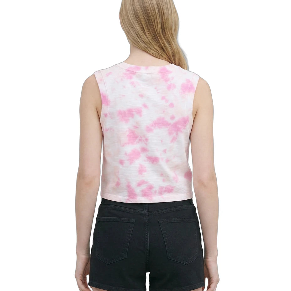 Woman wearing a sleeveless top with pink floral pattern and black shorts on a white background