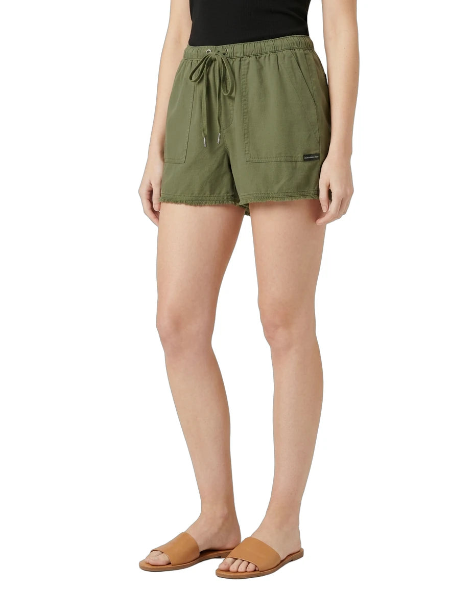 Person wearing green shorts on a white background