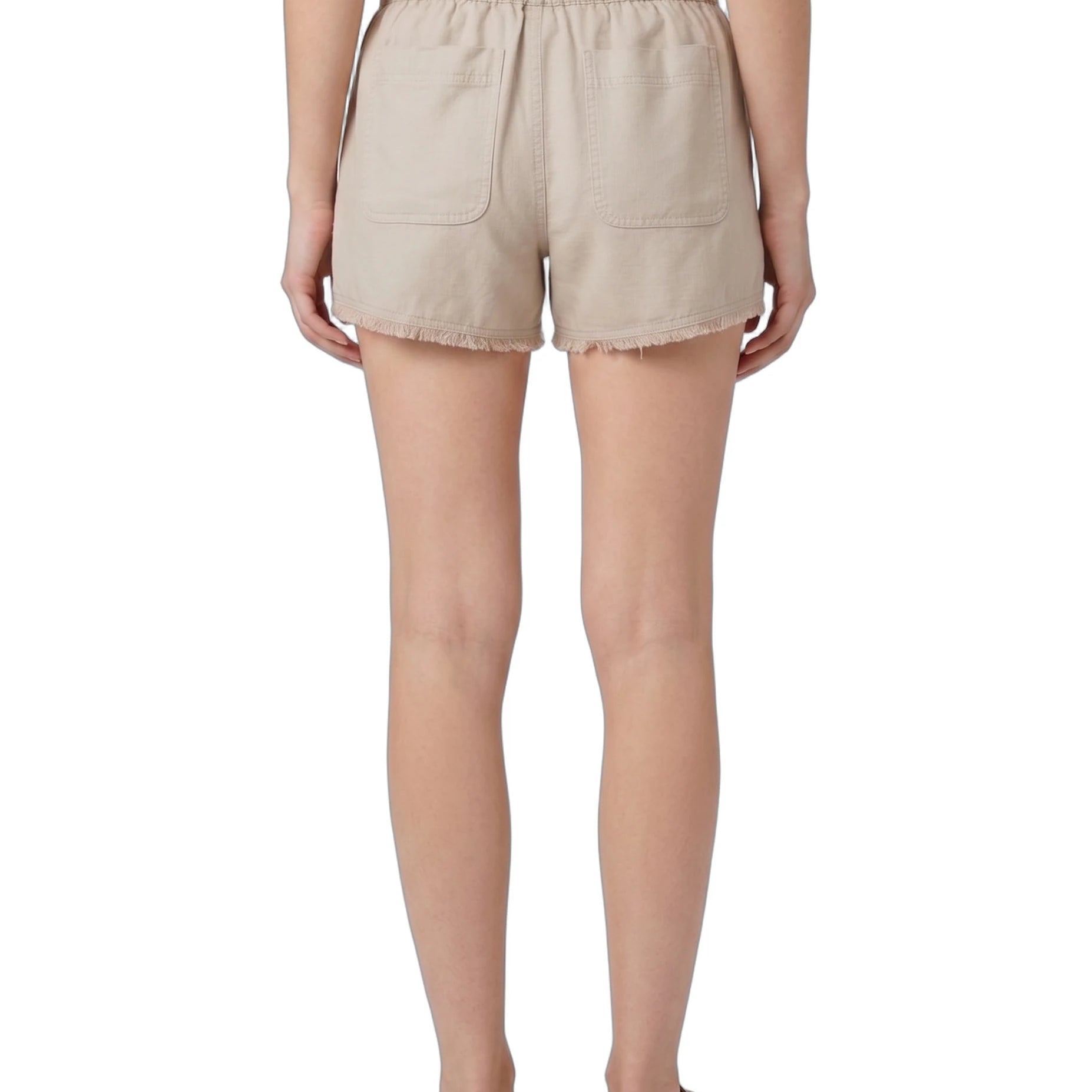 Beige shorts worn by a person on a white background