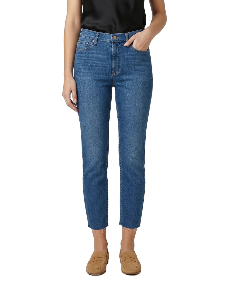 Person wearing blue jeans on a white background