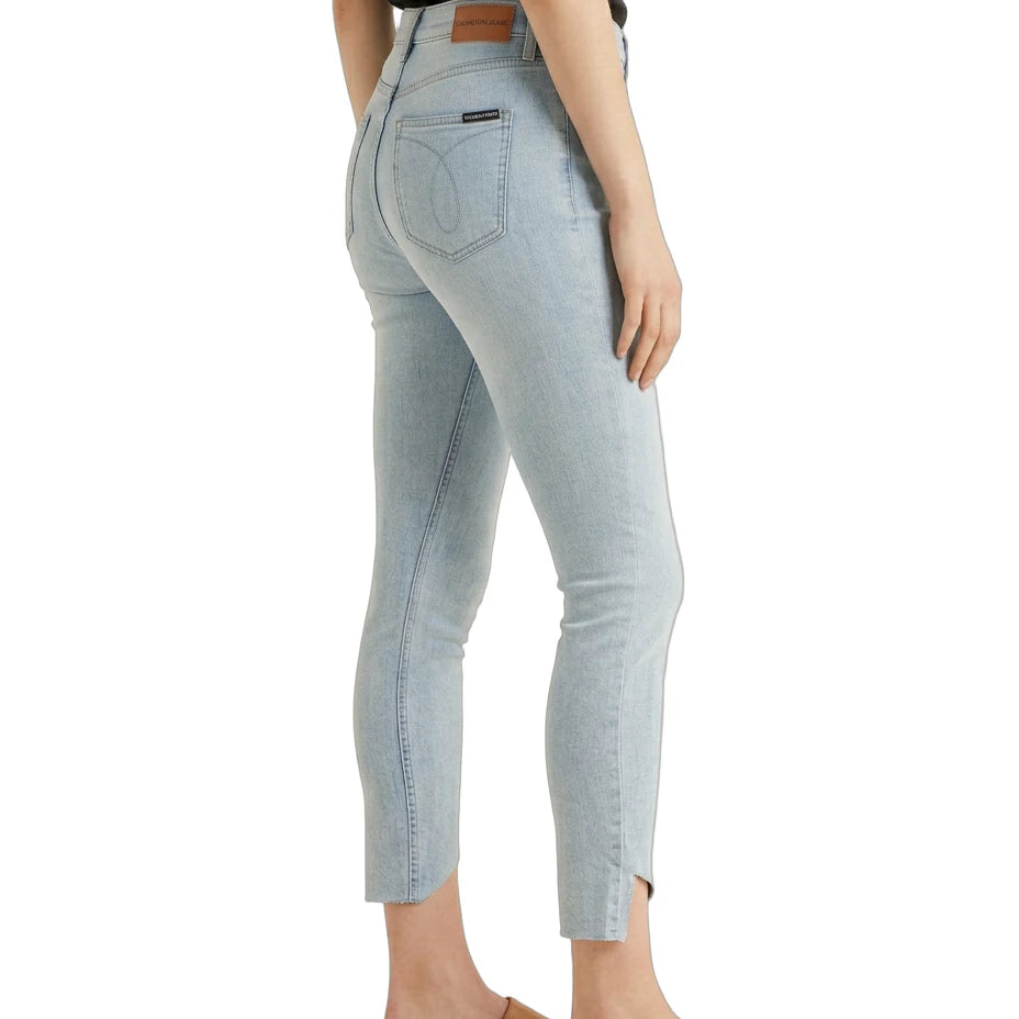 Light blue jeans worn by a person on a white background