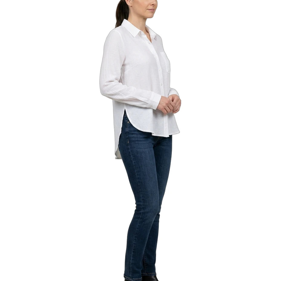 Woman wearing a white shirt and blue jeans on a white background