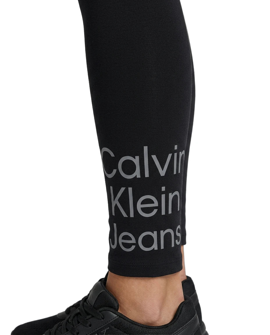 Black leggings with Calvin Klein Jeans logo on a white background