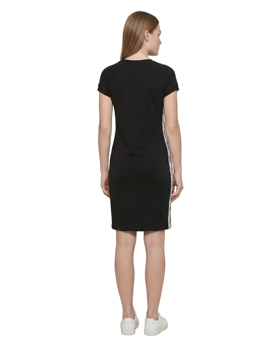 Black Calvin Klein dress with white stripes on the sleeves worn by a model on a white background