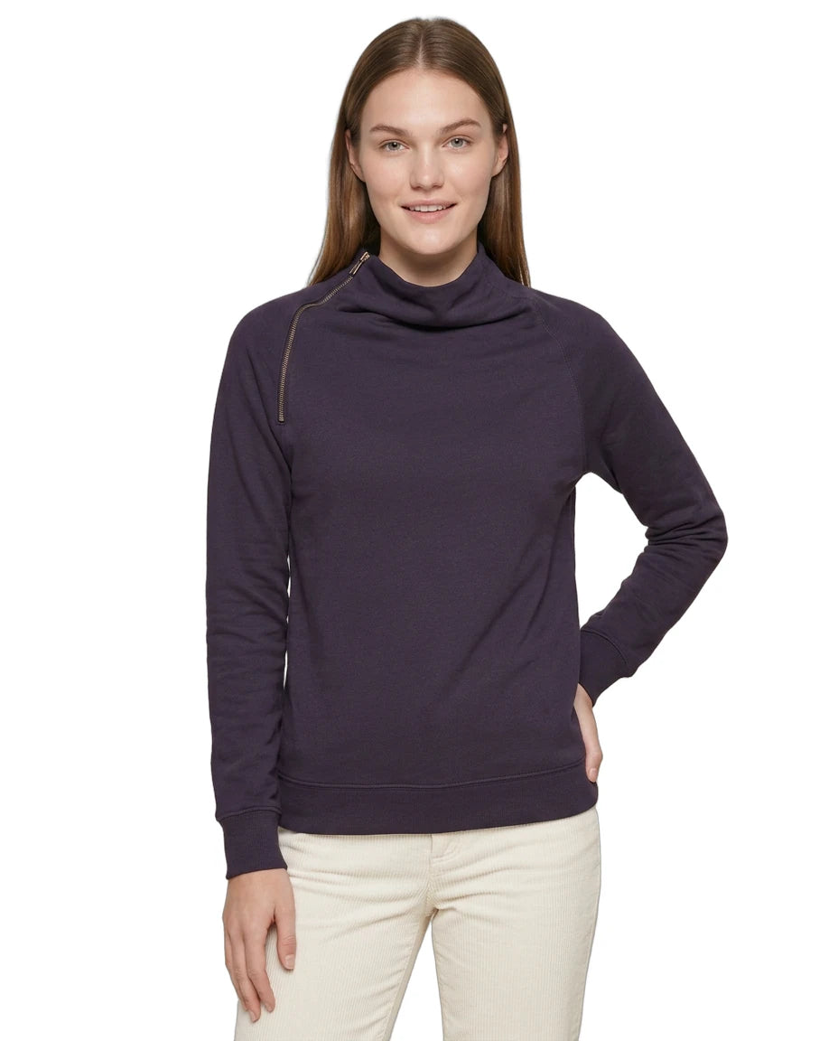 Woman wearing a purple Calvin Klein long-sleeve top with a cowl neck on a white background