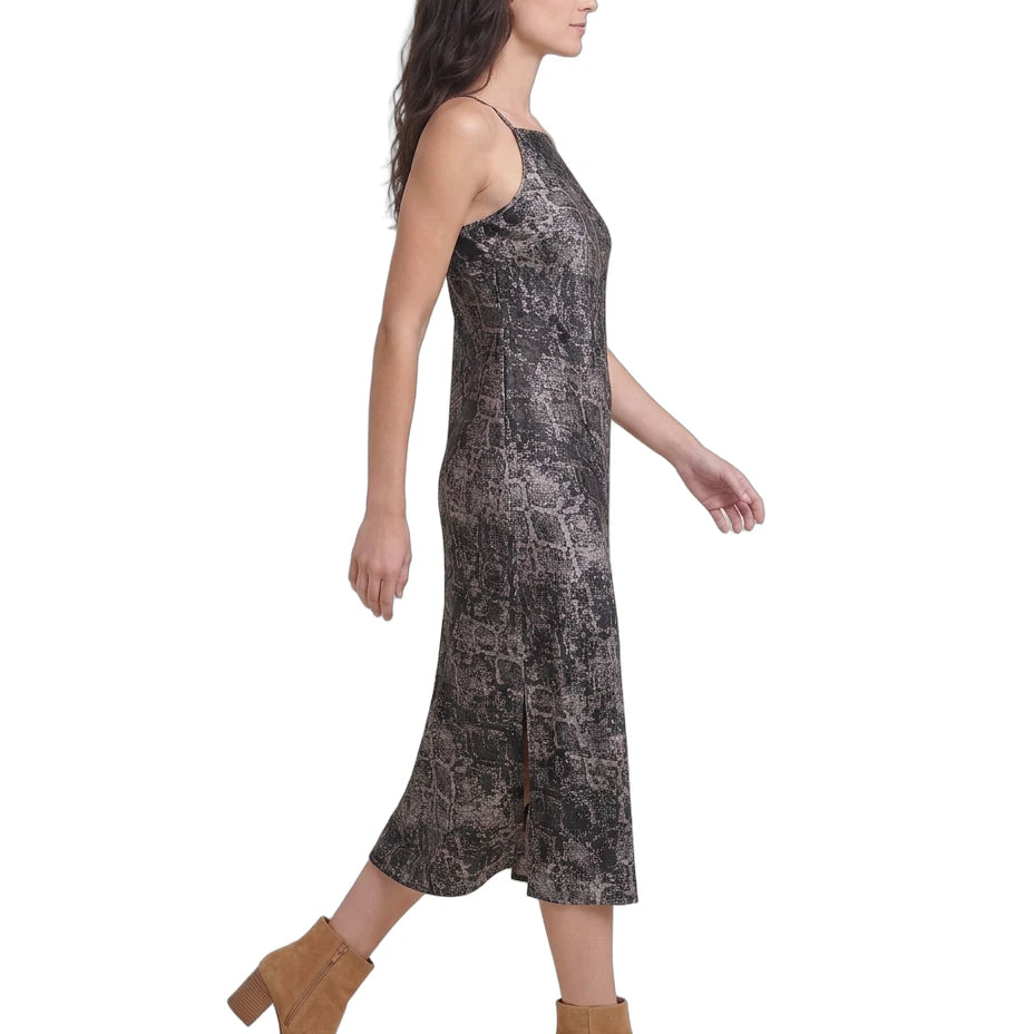 Woman wearing a patterned Calvin Klein dress on a white background