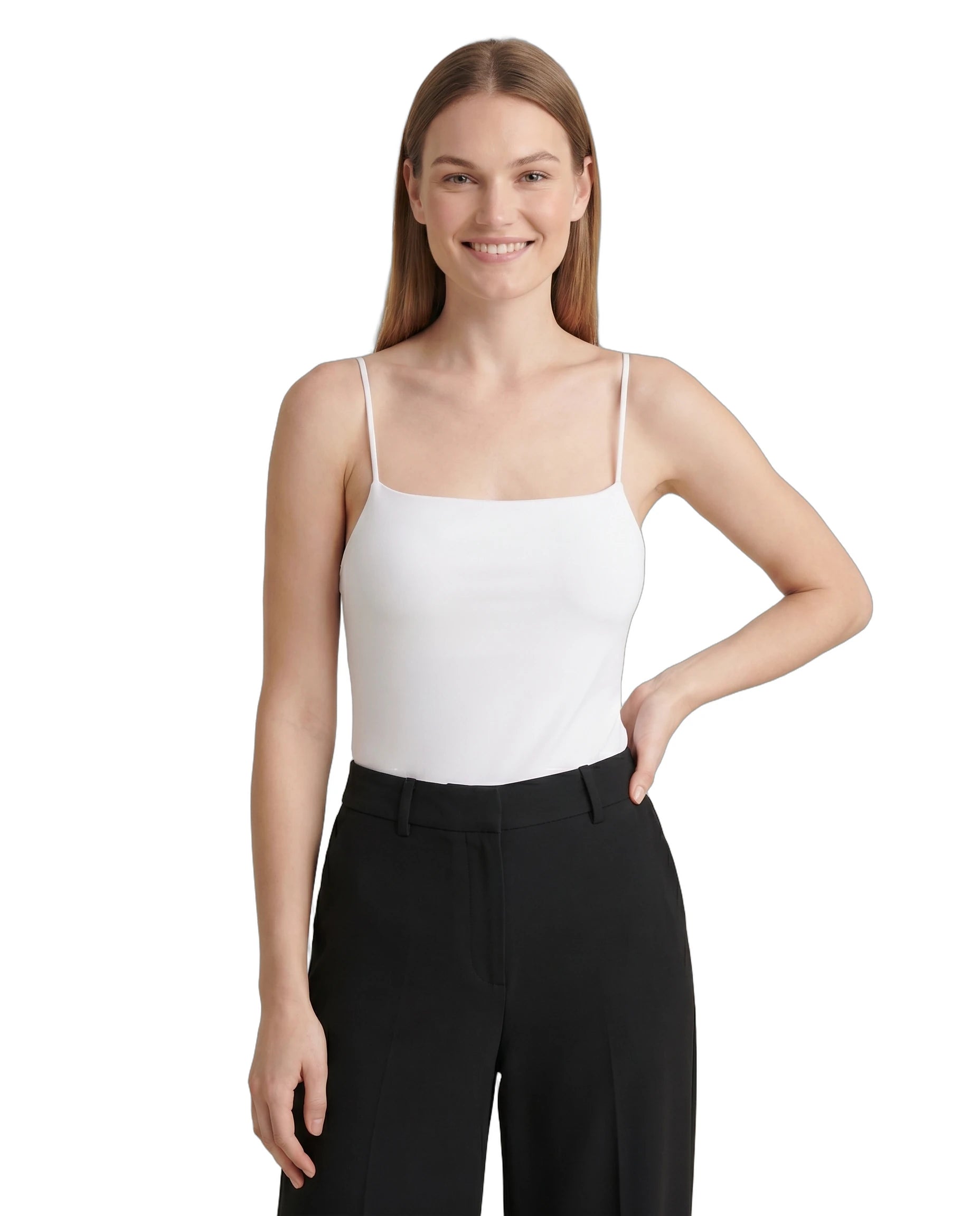 Woman wearing a white Calvin Klein bodysuit and black pants on a white background