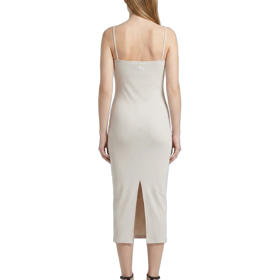 Woman wearing a white Calvin Klein dress on a white background