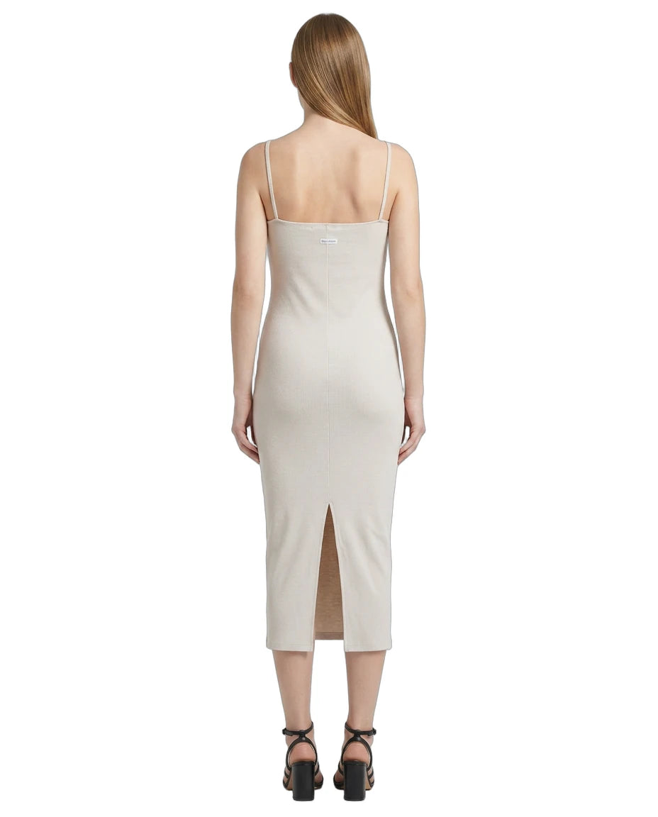 Woman wearing a white Calvin Klein dress on a white background