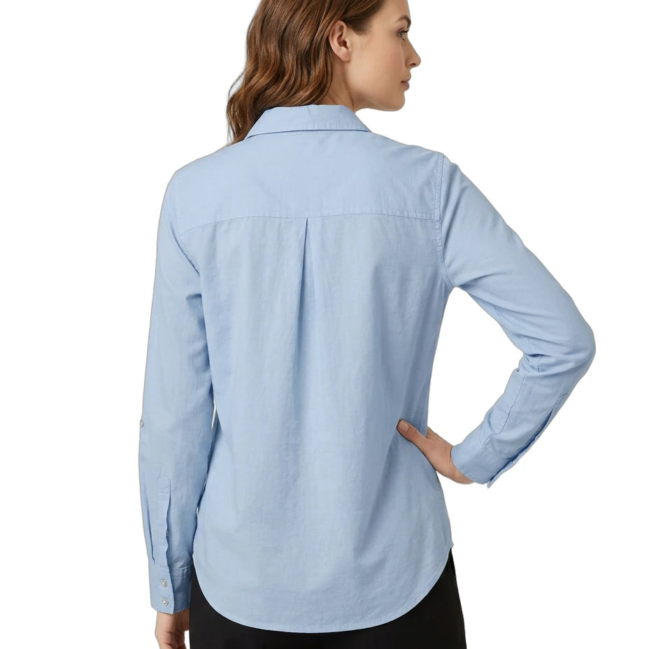 Woman wearing a light blue Calvin Klein shirt on a white background