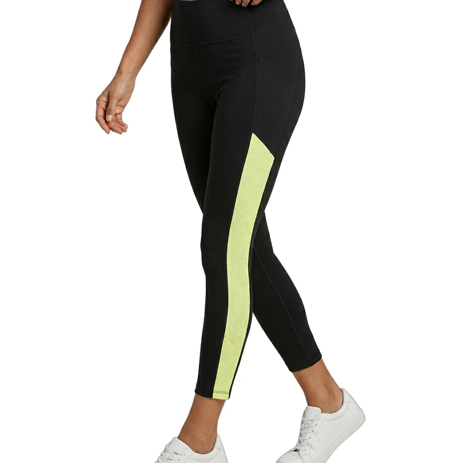 Black Calvin Klein leggings with a yellow stripe worn by a person on a white background