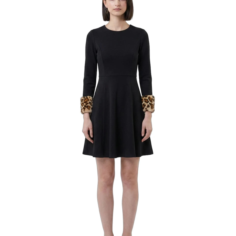 Black Calvin Klein dress with leopard print cuffs worn by a model on a white background