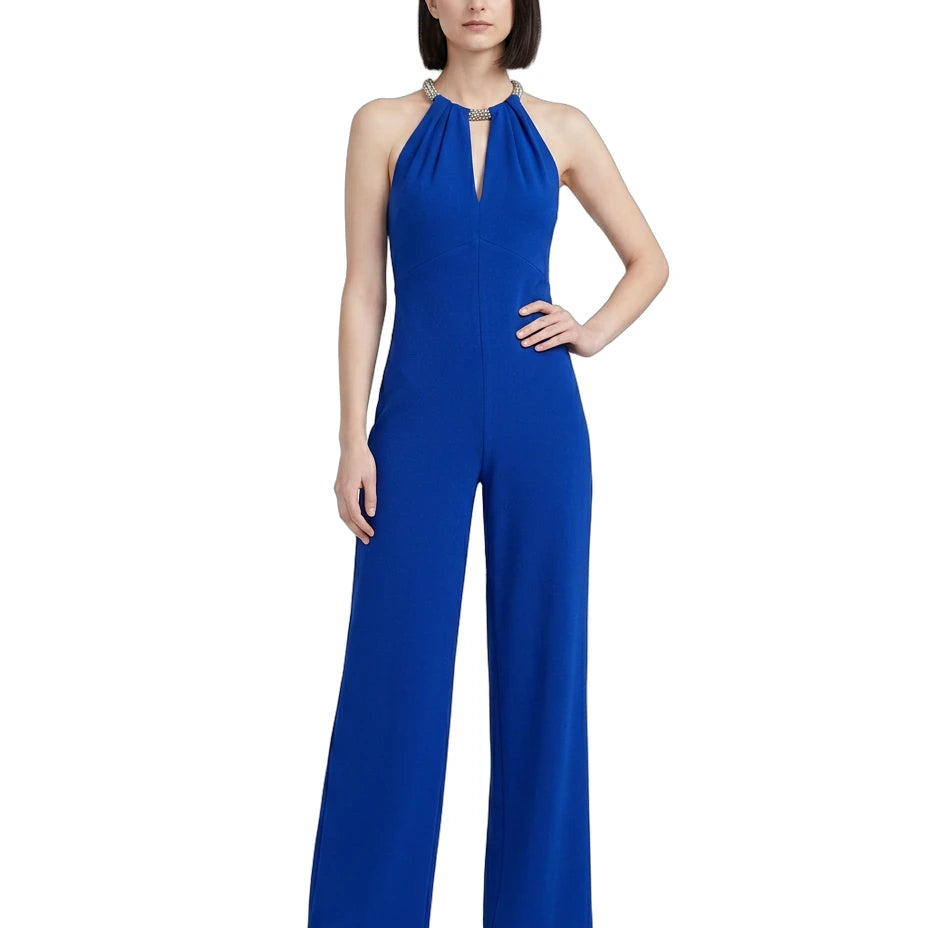 Woman wearing a blue jumpsuit on a white background