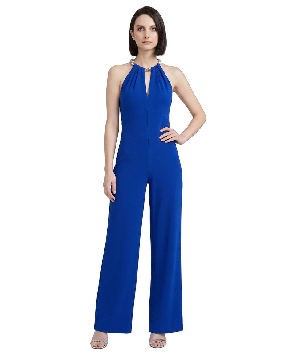 Woman wearing a blue jumpsuit on a white background