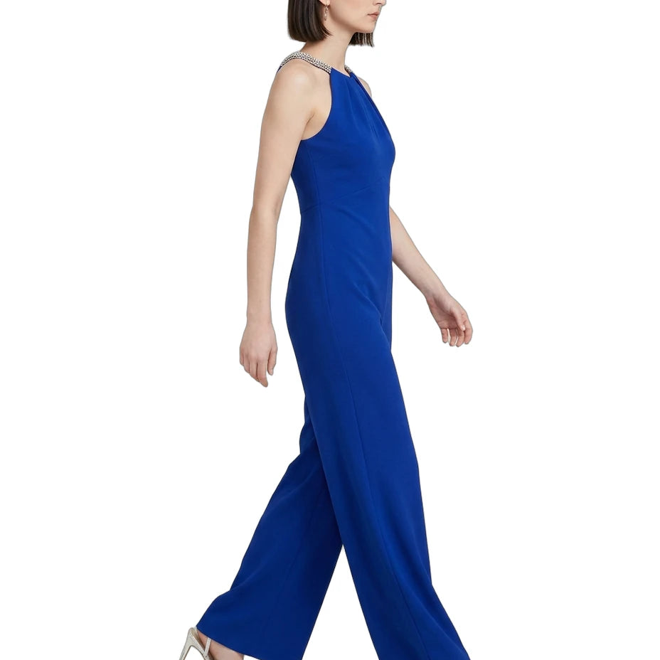 Woman wearing a blue jumpsuit on a white background