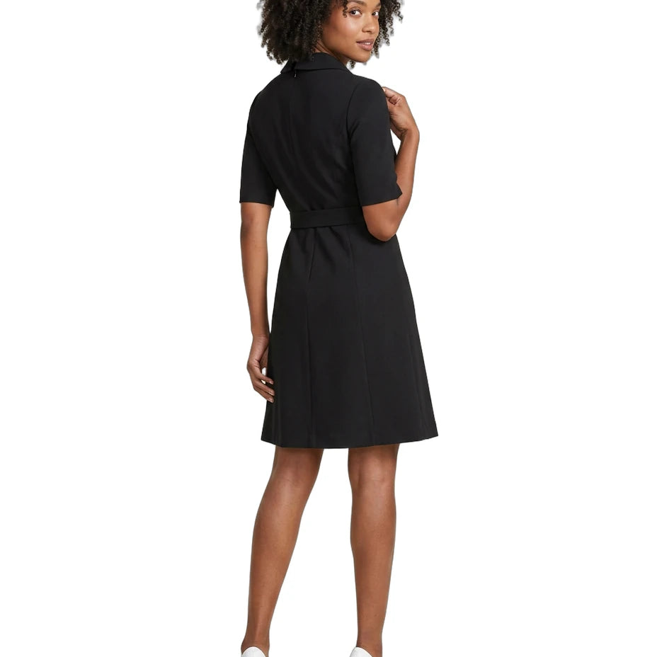 Woman wearing a black dress on a white background