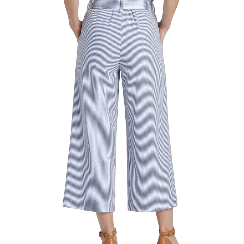 Light blue and white striped wide-leg pants worn by a person on a white background