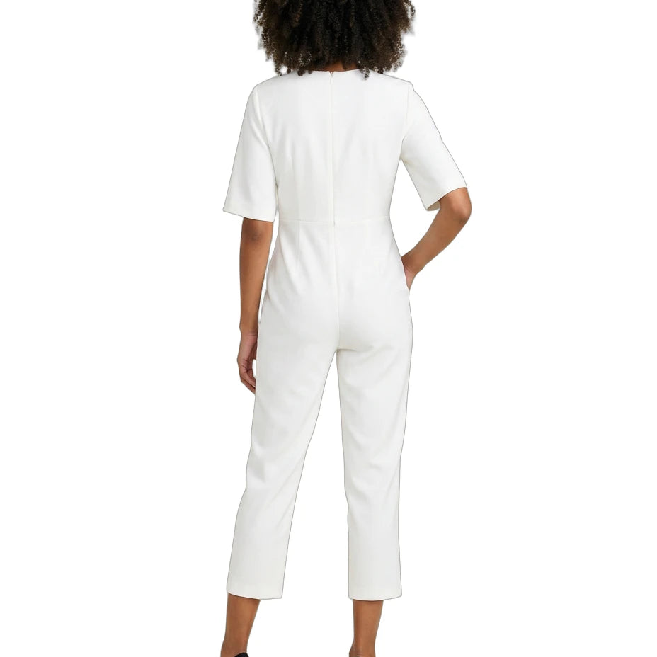 Person wearing a white jumpsuit on a white background