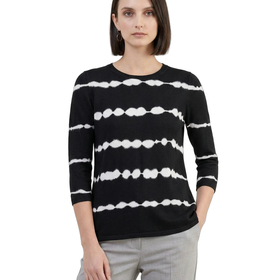 Woman wearing a black sweater with white stripe pattern on a white background