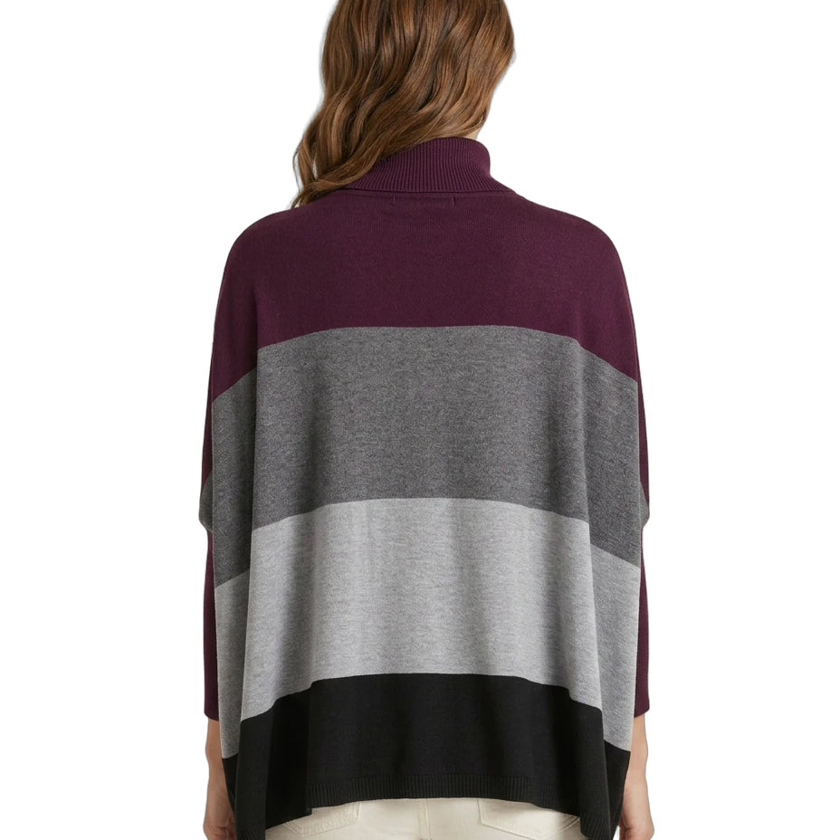 Woman wearing a color-blocked Calvin Klein sweater with a white background