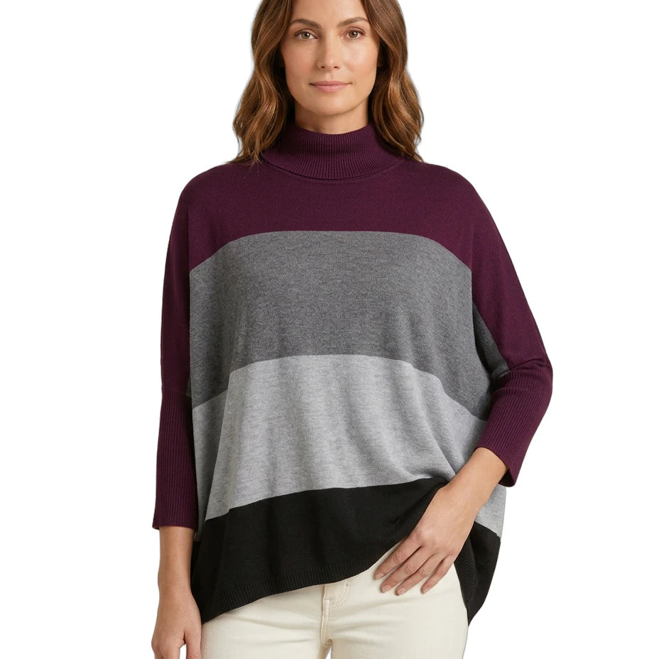 Woman wearing a color-blocked Calvin Klein sweater with a white background