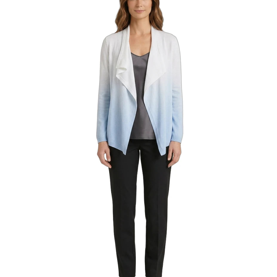 Woman wearing a gradient cardigan over a gray top and black pants on a white background