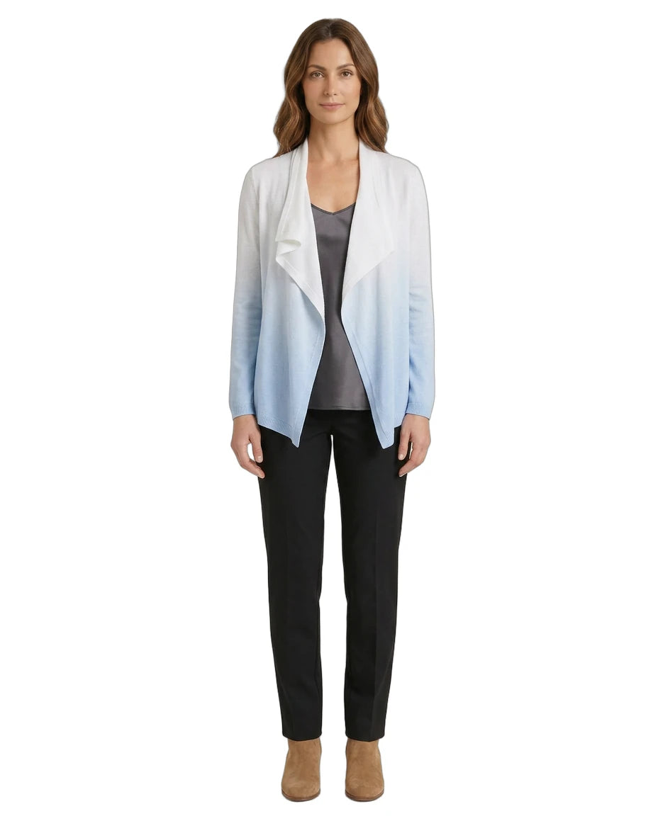 Woman wearing a gradient cardigan over a gray top and black pants on a white background