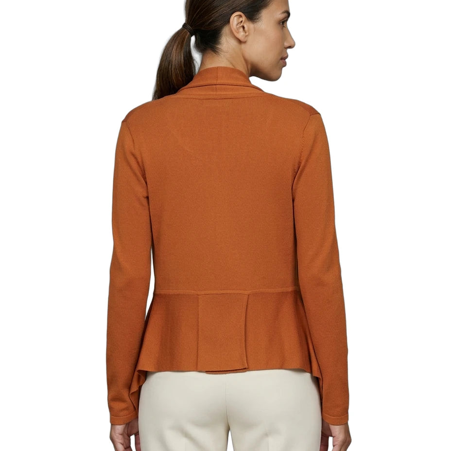 Woman wearing an orange peplum Calvin Klein cardigan on a white background