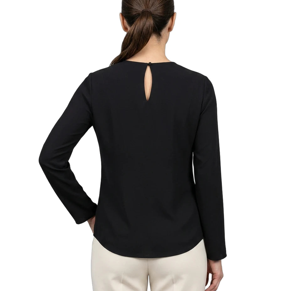 Woman wearing a black long-sleeve top with a cutout back design on a white background