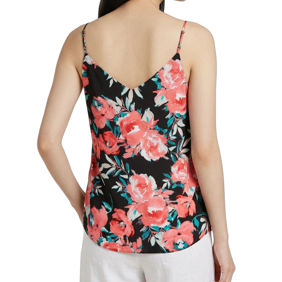 Woman wearing a floral tank top with a white background