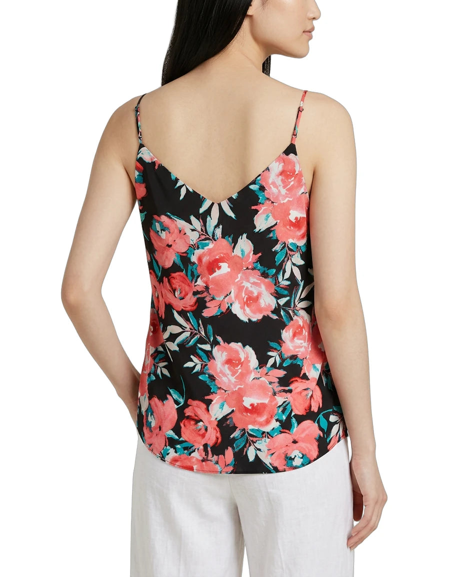Woman wearing a floral tank top with a white background