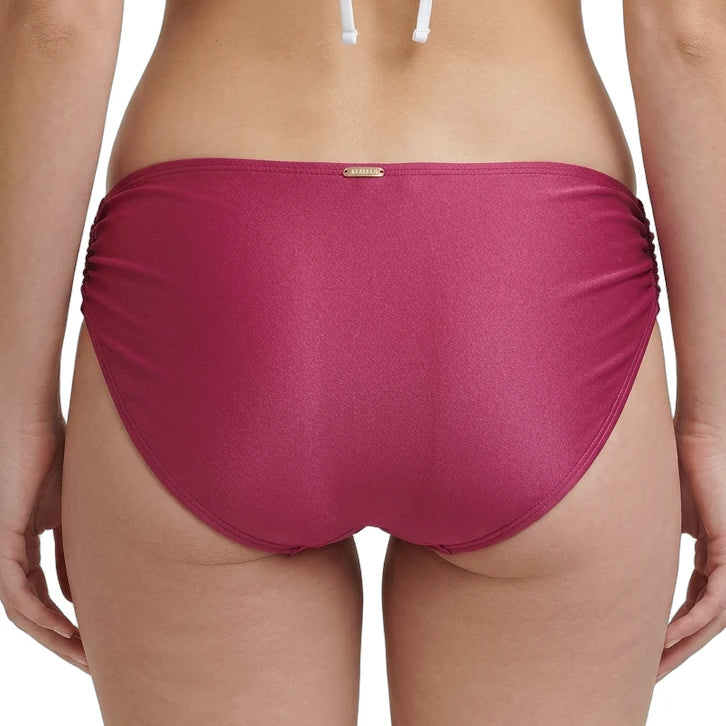 rose calvin klein bikini bottom worn by a person on a white background