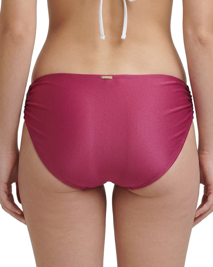 rose calvin klein bikini bottom worn by a person on a white background