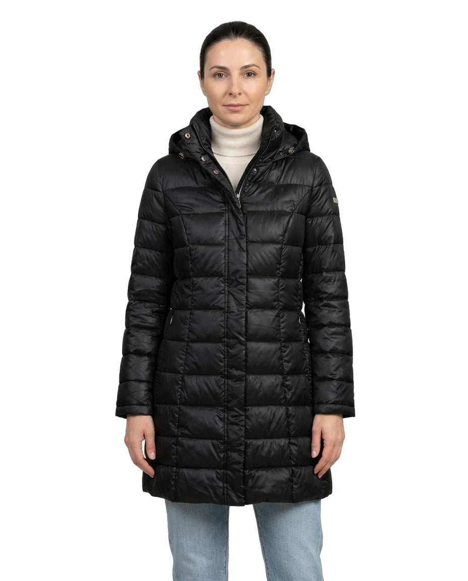 Woman wearing a black Calvin Klein winter coat on a white background