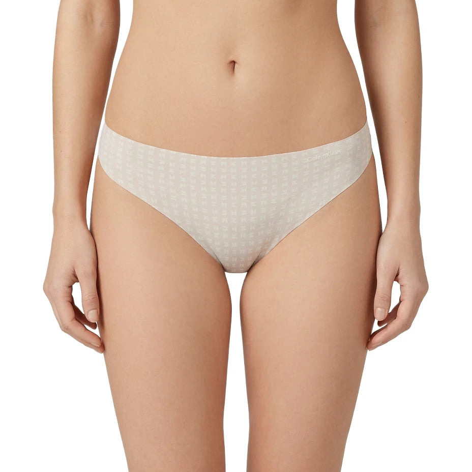 Beige patterned underwear worn by a person on a white background