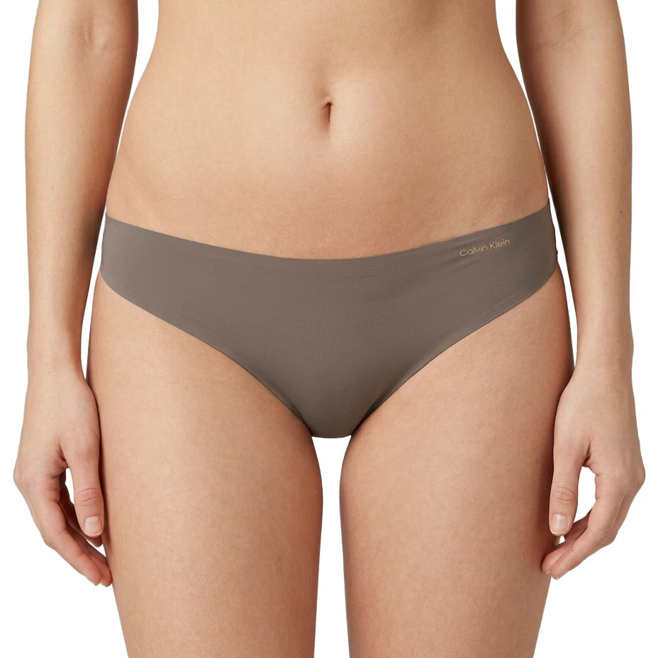 Gray underwear worn by a person on a white background
