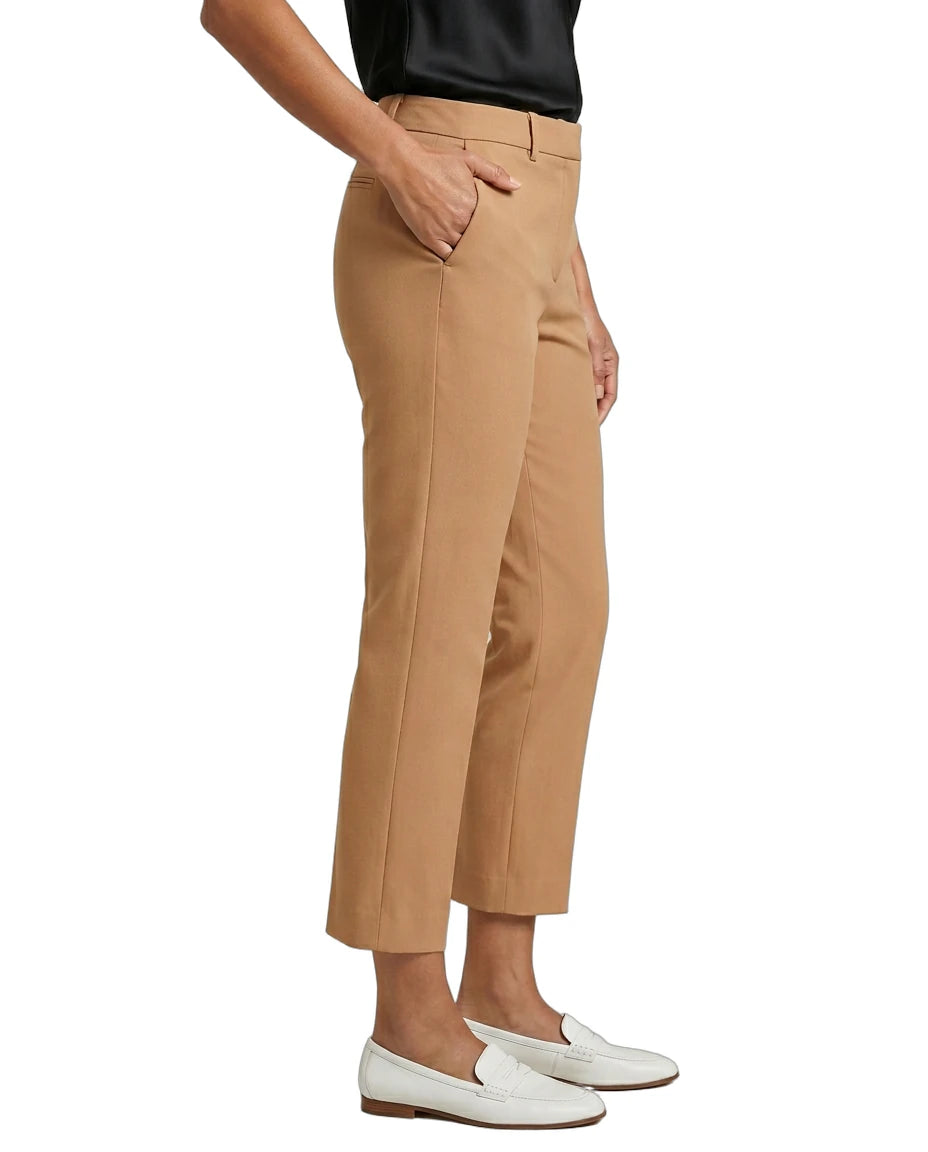 Tan Calvin Klein pants worn by a person on a white background