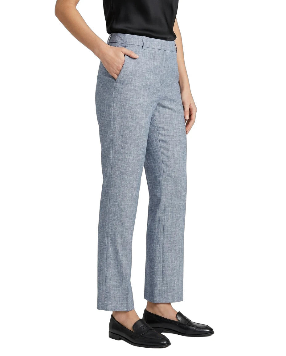 Person wearing Calvin Klein blue checkered pants on a white background