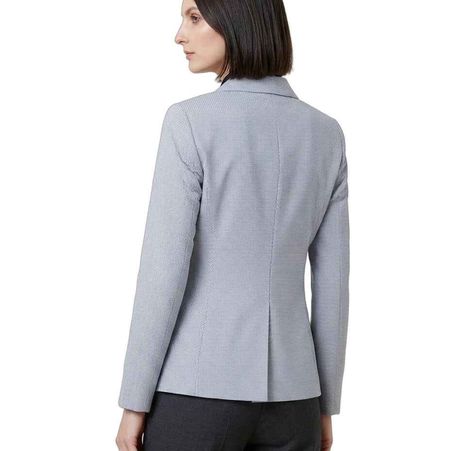 Woman wearing a gray blazer on a white background