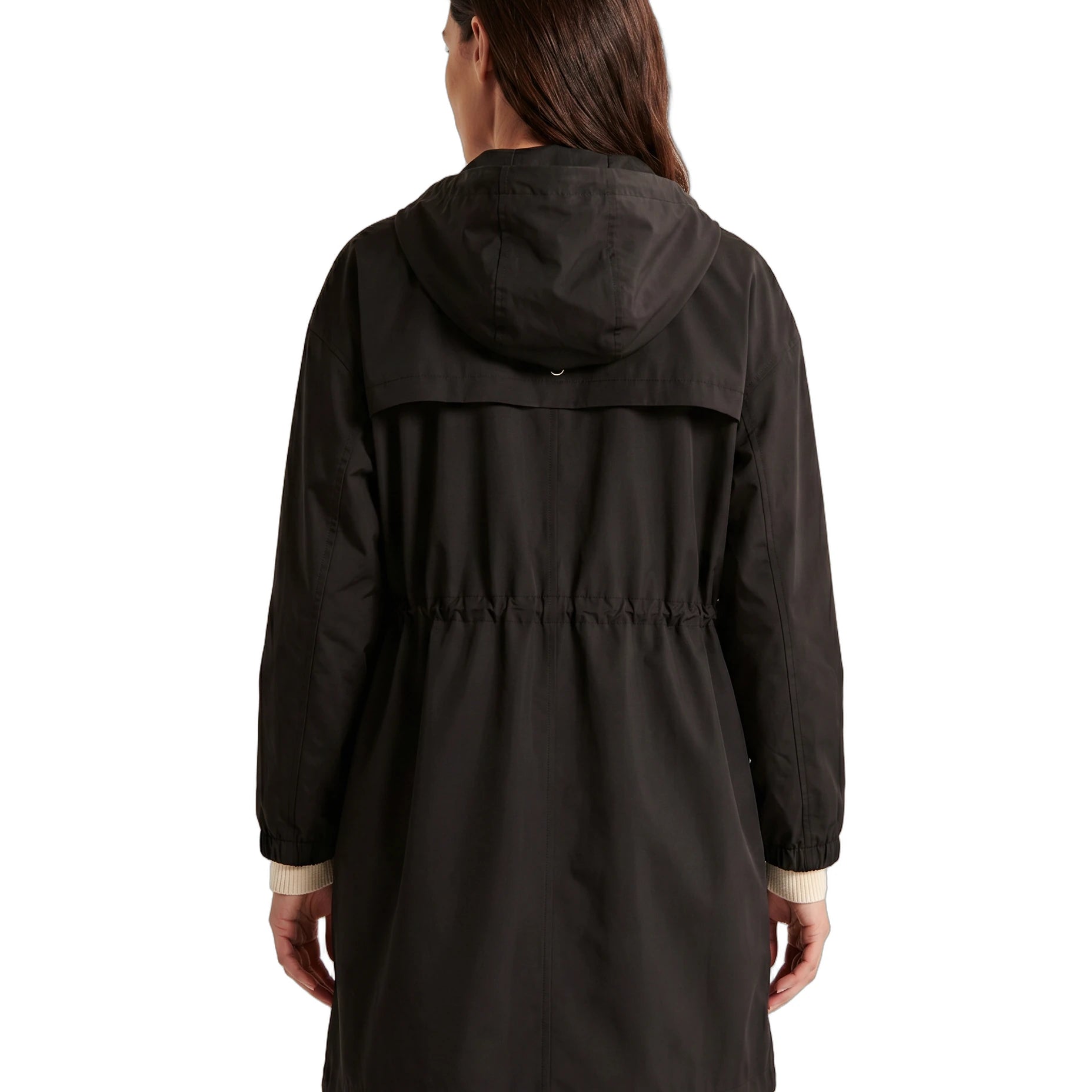 Woman wearing a black Calvin Klein coat viewed from the back, white background