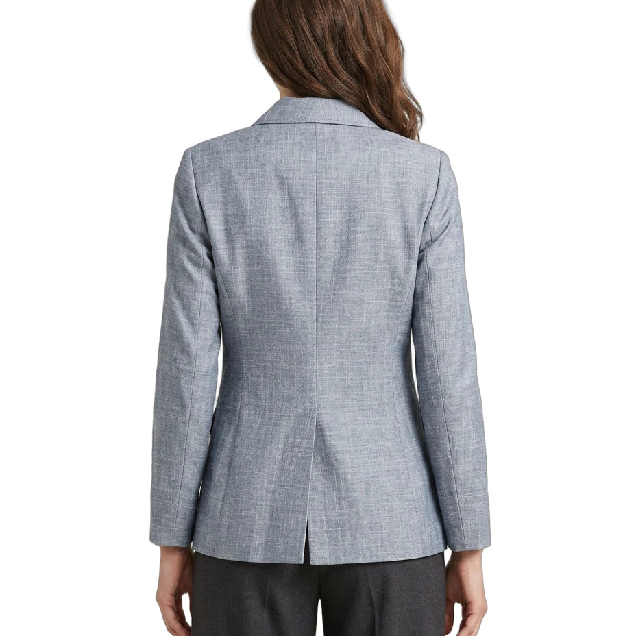 Person wearing a gray Calvin Klein checkered blazer on a white background