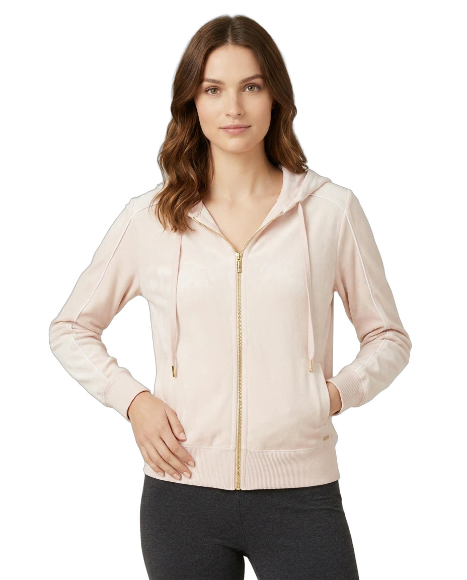 Woman wearing a Calvin Klein light pink hoodie on a white background