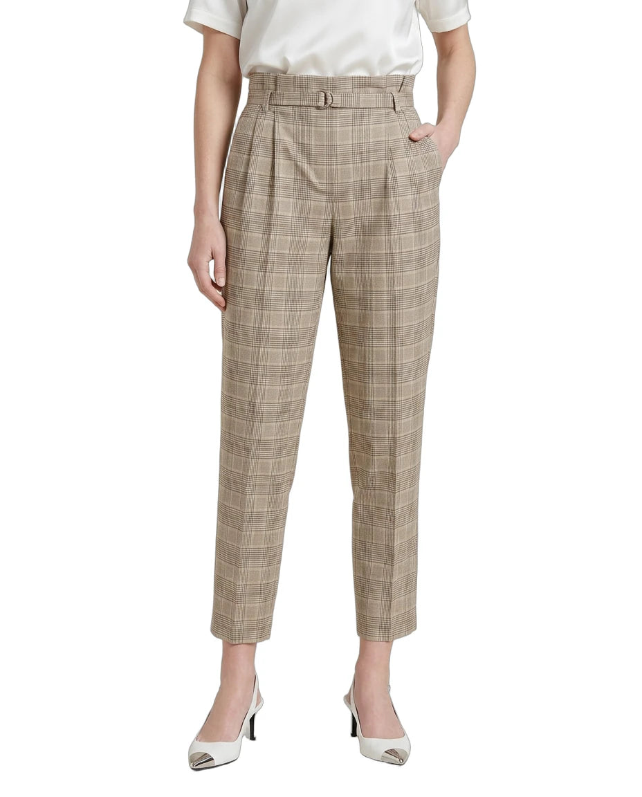 Person wearing Calvin Klein plaid pants on a white background