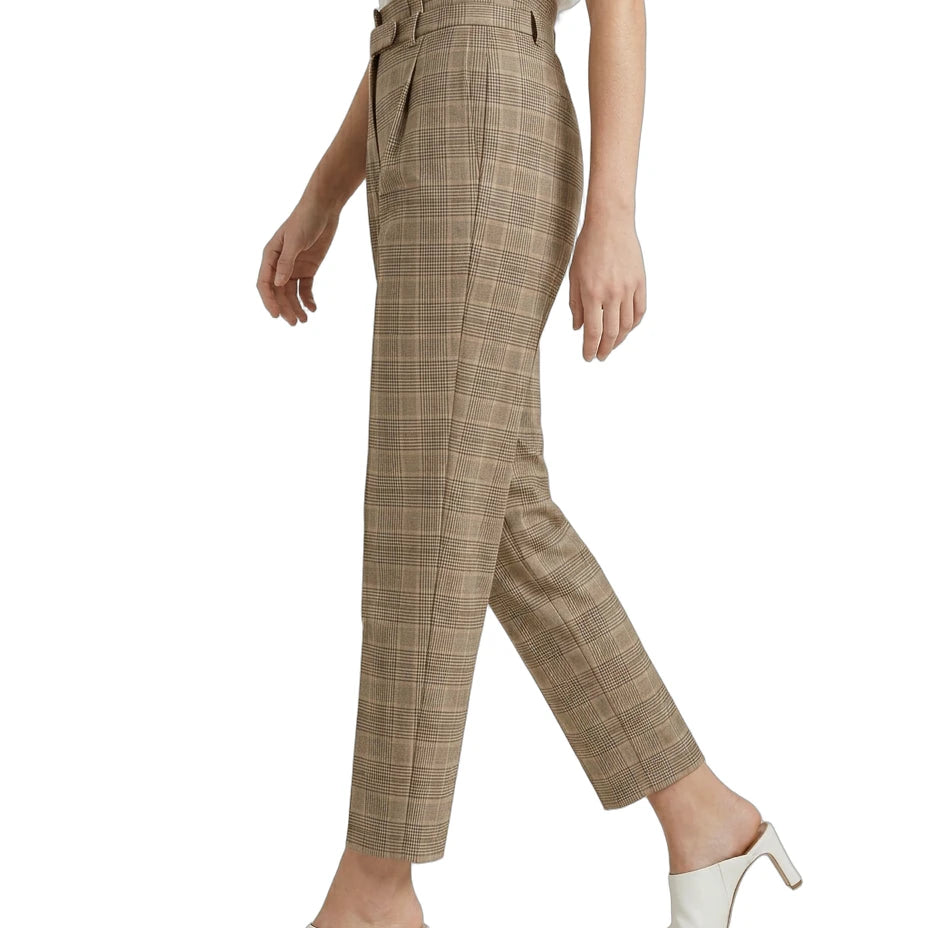 Calvin Klein Plaid pants worn by a person on a white background