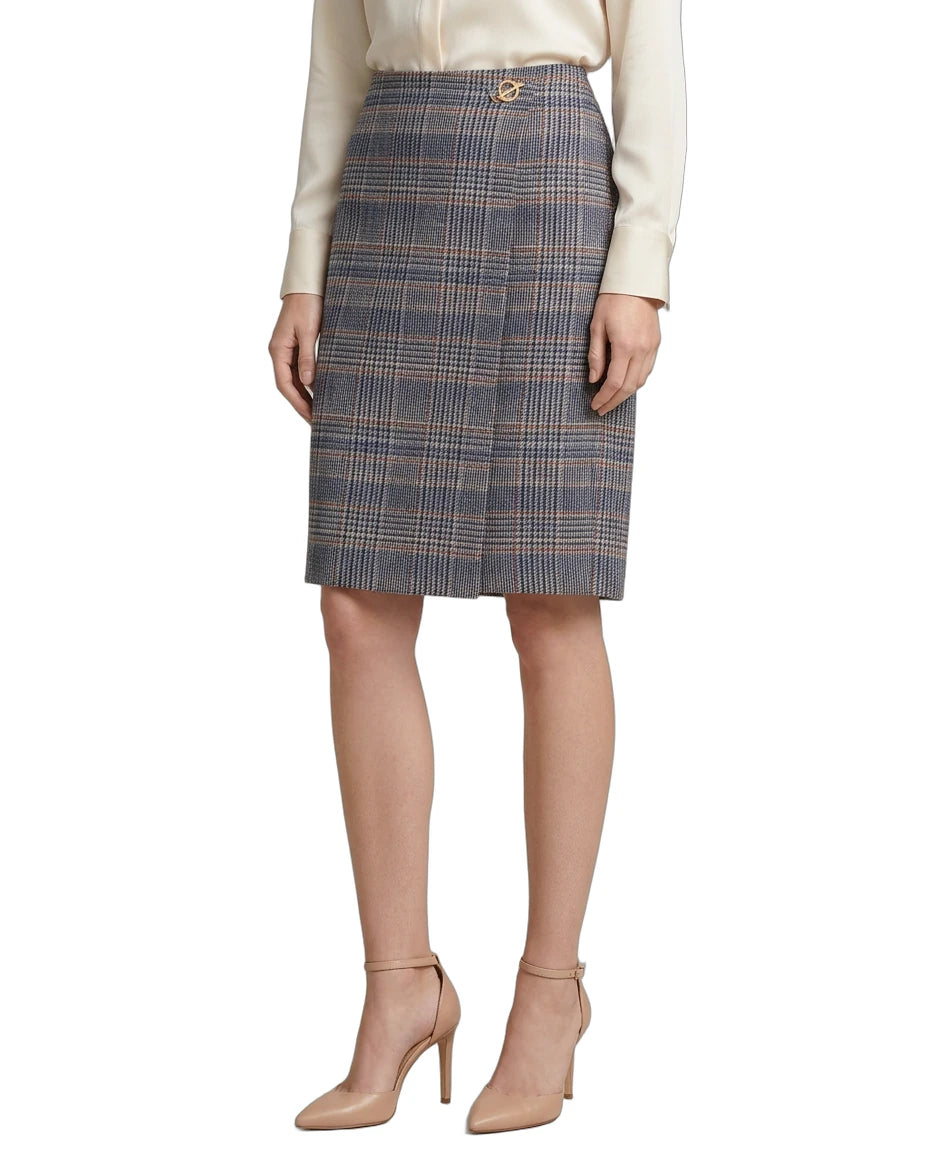 Person wearing a Calvin Klein plaid skirt on a white background