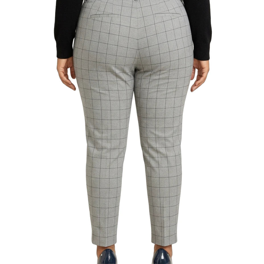Calvin Klein gray checkered pants worn by a person on a white background