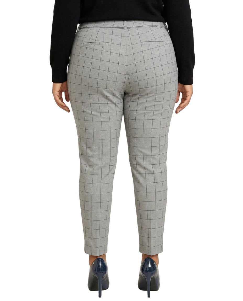 Calvin Klein gray checkered pants worn by a person on a white background