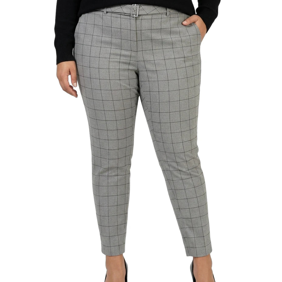 Calvin Klein gray checkered pants worn by a person on a white background