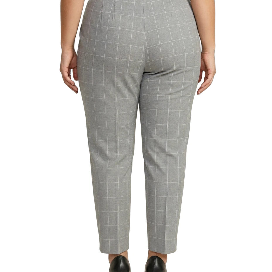 Calvin Klein gray checkered pants worn by a person on a white background
